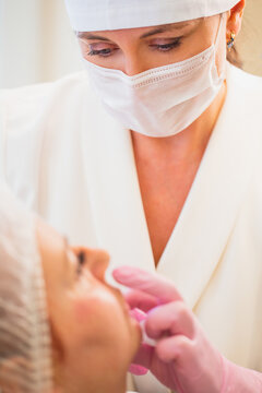 A woman doctor cosmetologist is receiving patients in a clinic of aesthetic medicine - skin correction and plastic surgery