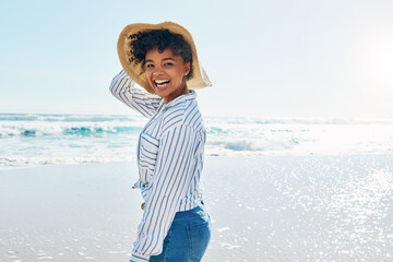 Travel, summer and portrait of black woman at beach on holiday, vacation and weekend by ocean. Happy lifestyle, nature and excited girl laugh, relaxing and enjoying adventure, freedom and fun by sea