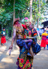 Friends hugging each other while playing characters of local village drama