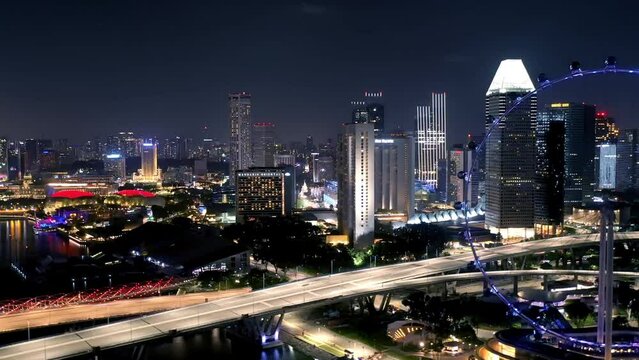 aerial view Sunset scene video of the Marina Bay Sands and Gardens By The Bay in Business Center District of Singapore City Skyline.