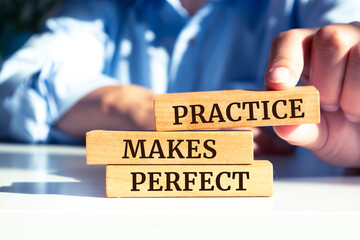 Close up on businessman holding a wooden block with 