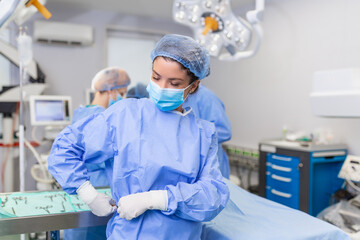 Young female surgeon getting ready to operate