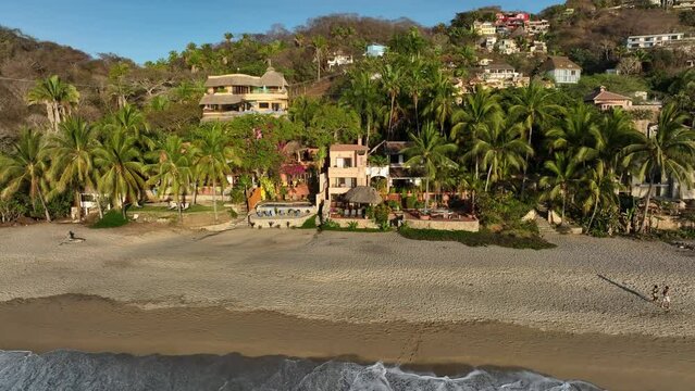 Sayulita, Mexico's main beach and town. Establishing Aerial Fly Drone View 4k high resolution.
