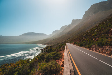 Road going from Hermanus to Cape Town, mountains touching the sea, South Africa