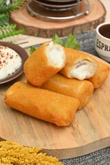 some mayonnaise risol cakes on wooden accessories or wooden plates (in indonesia called Risol Mayo).