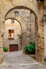 Medieval arcade on a alley at Anghiari, Province of Arezzo, Tuscany, Italy
