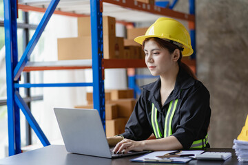Customs warehouse worker with laptop phone Inspection of the goods of the Customs Department Young woman in yellow vest and hat checking boxes on blurred storage shelf
