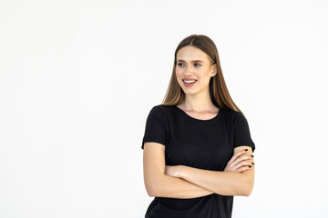 Smiling brunette woman posing with crossed arms and looking at the camera over white background