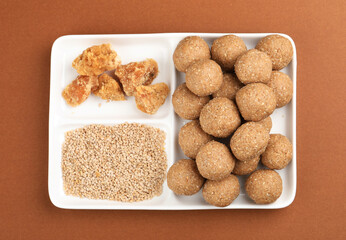 Til or sesame and gud or jaggery laddu, a sweet dish made in Maharastra during sankranti festival