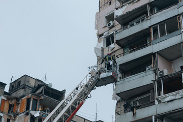 A Russian rocket flew into a residential building in the city of Dnipro. Consequences of a missile strike. Rescuers are doing rescue work. War in Ukraine.
