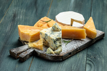 Different types of cheese. Cheeses mix set dor blu chedar camamber brie. place for text, top view