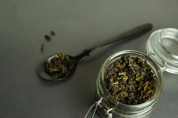 Chinese green oolong tea in a glass jar