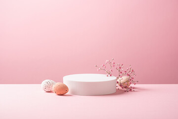 Abstract empty white podium with Easter quail eggs and spring flowers on pink background. Mock up...