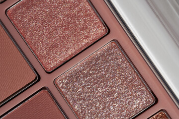 New glitter rose gold and beige matte eyeshadow macro photo. Cosmetic texture banner background