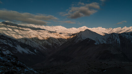 Spiti, Himachal Pradesh, India - April 1st, 2021 : Beautiful landscape with high mountains with illuminated peaks, Amazing scene with Himalayan mountains. Himalayas