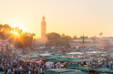 Sunset on Jamaa el Fna (also Jemaa el-Fnaa, Djema el-Fna or Djemaa el-Fnaa) is a square and market...