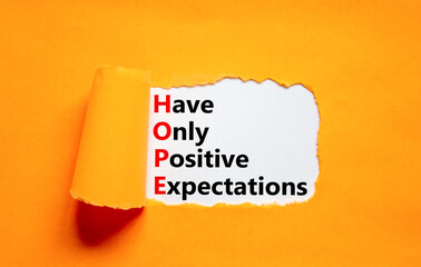 HOPE have only positive expectations symbol. Concept words HOPE have only positive expectations on paper on beautiful orange background. Business HOPE have positive expectations concept. Copy space