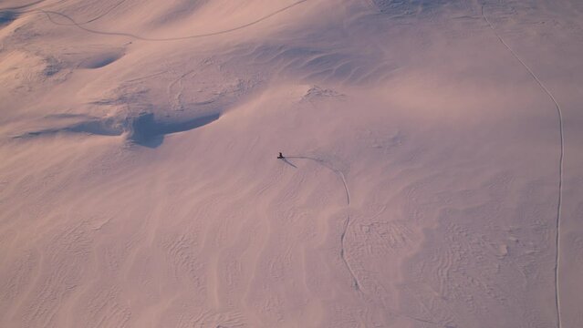 A man snowboarding a remote mountain in Valdez, Alaska