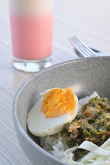 boiled eggs in a plate on a wooden table (natural light)