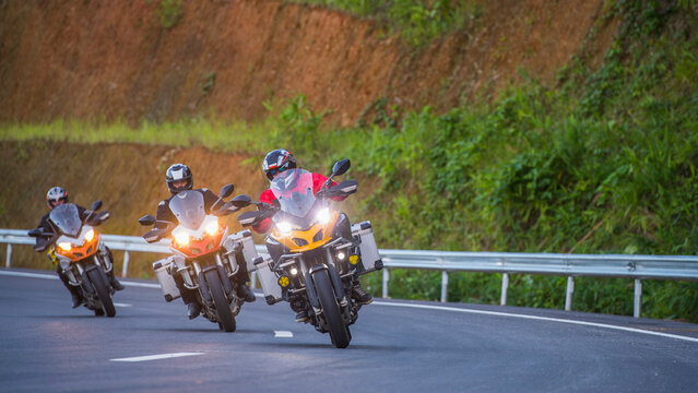 Three people riding motorcycles, Nan, Mueang Chiang Rai District, Thailand