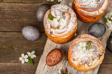 Easter cake Cruffin or sweet bread kulich with painted eggs. Traditional festive baking