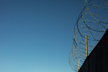 Barbed wire fence. Details of industrial area.