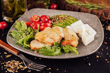 chicken breast with avocado salad and arugula