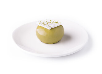 Trendy green mousse cake with mirror glaze decorated