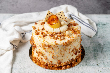 Honey and hazelnut cake on a stone background. Fruit and nut birthday cake. close up