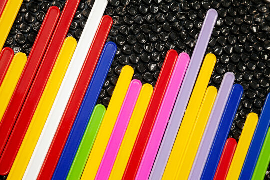 Creative representation of an equalizer sound wave. Statistic in bar chart made of colorful plastic sticks on black background