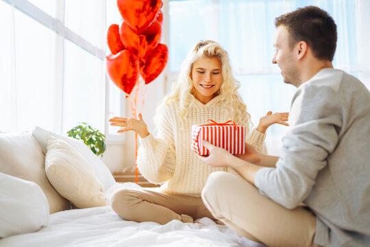 Exchange of gifts. Romantic day together. Valentines day, couple, relationships and people concept.