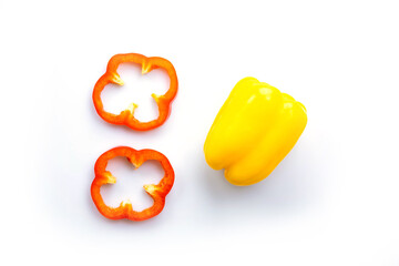 sliced  of​​ orange red color bell peppers  and a yellow bell pepper isolated on white background