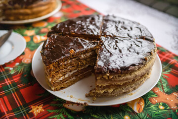 Delicious chocolate Christmas cake on plate on table