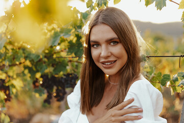 Young woman posing in the grape fields.
