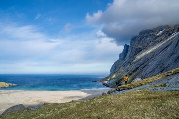 Views of Bunes beach in Lofoten, Norway, during spring on a clear sunny day with some clouds