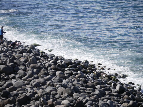 Angler am Meer