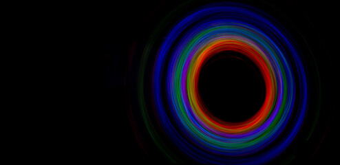 Black hole concept with ring of colorful lights around in astronomy concept