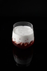 Cream strawberry on the black background