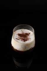 Irish coffee on the black background
