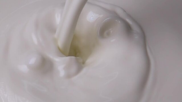 Splashes of milk and cream in super slow motion