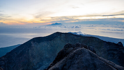 Sunrise at the top of the Ijen volcano. Panoramic view of East Java, Indonesia. The background of the natural landscape.