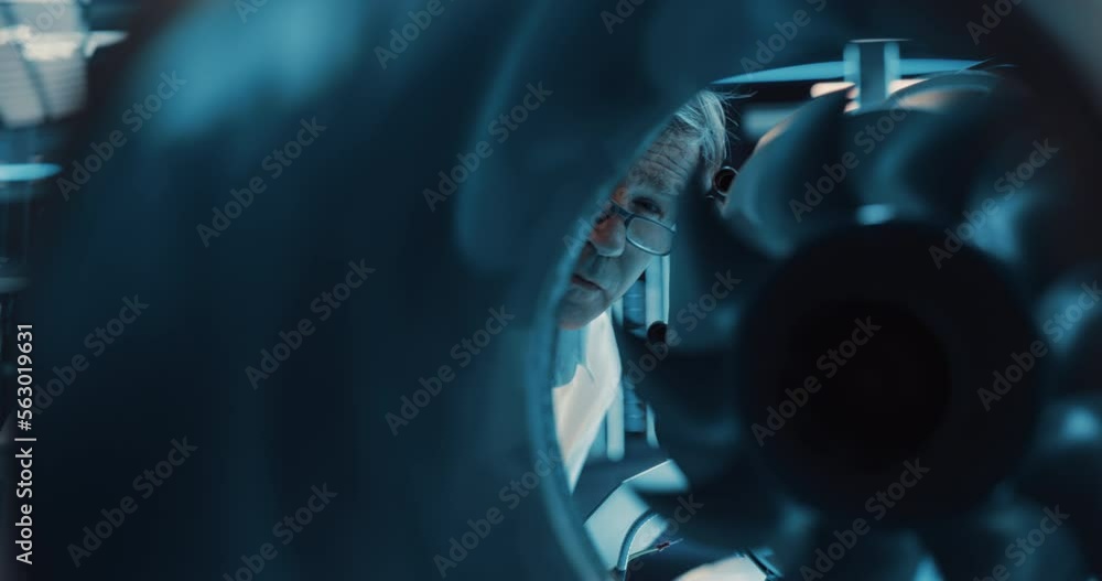 Poster Thrust Engine Engineer Working on a Project with Futuristic Turbine Motor, Standing with Laptop Computer in Scientific Technology Lab. Science Professor Developing a Futuristic Engine