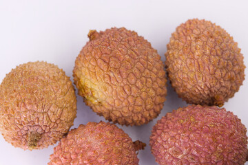 Lichi Fruits on white background. Close-up and selective focus. Macro.