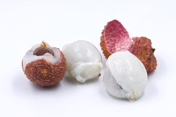 Fresh ripe lychees on white background.