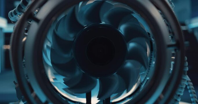 Cinematic Footage of a Rotating Fan Working Inside a High Tech Prototype Turbine Engine. High tech Jet Engine Research and Development in a Factory Facility with Modern Equipment