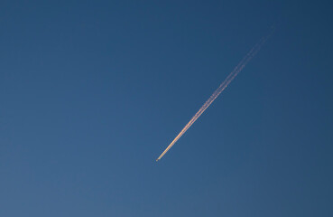 Airplane in blue the sky.