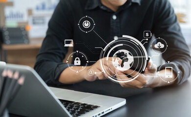 Male are using a mobile phone wifi connection laptop on the desk.