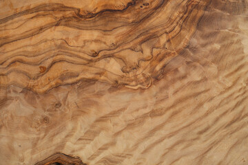 Olive wood texture background. Vintage wood. Surface of texture with natural pattern. Close up cross section of tree texture background.