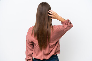 Young pretty caucasian woman isolated on white background in back position and thinking