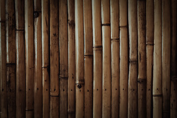 Naklejka premium brown bamboo texture background with light and shadow